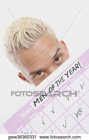 Stock Image - Portrait of a businessman with his progress report. Fotosearch