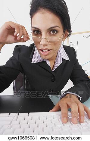 Portrait of a businesswoman looking surprised View Large Photo Image Stock Image - Portrait of a businesswoman looking surprised. Fotosearch