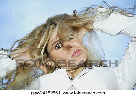 Portrait of a businesswoman pulling her hair in frustration View Large Photo Image Stock Image - Portrait of a businesswoman pulling her hair in frustration. Fotosearch