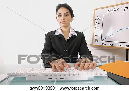Portrait of a businesswoman using a computer keyboard View Large Photo Image Stock Image - Portrait of a businesswoman using a computer keyboard. Fotosearch