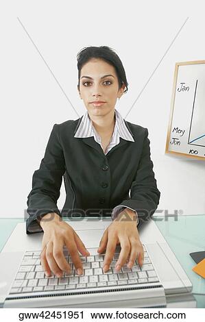 Portrait of a businesswoman using a laptop View Large Photo Image Stock Image - Portrait of a businesswoman using a laptop. Fotosearch