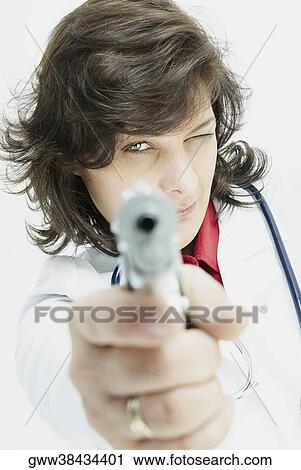 Portrait of a female doctor aiming with a handgun View Large Photo Image Stock Image - Portrait of a female doctor aiming with a handgun. Fotosearch