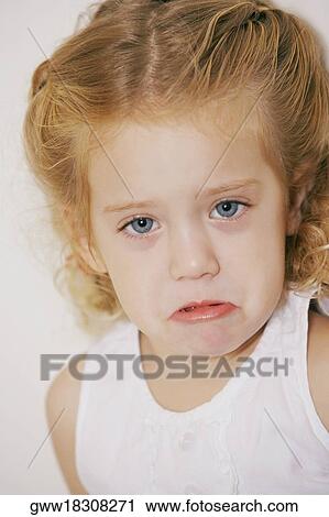 Stock Image - Portrait of a girl crying. Fotosearch