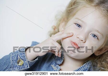 Portrait of a girl making a face View Large Photo Image Stock Image - Portrait of a girl making a face. Fotosearch