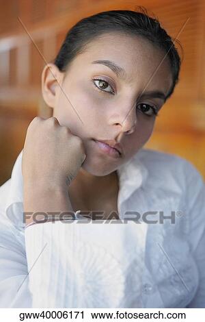 Stock Image - Portrait of a girl thinking. Fotosearch