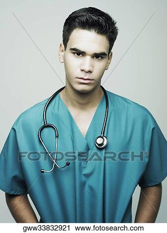 Portrait of a male surgeon wearing an operating gown View Large Photo Image Stock Image - Portrait of a male surgeon wearing an operating gown. Fotosearch
