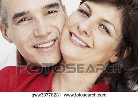 Portrait of a mature couple smiling View Large Photo Image Stock Image - Portrait of a mature couple smiling. Fotosearch