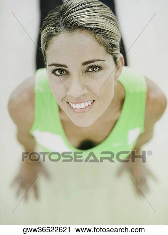 Portrait of a mid adult woman exercising View Large Photo Image Stock Image - Portrait of a mid adult woman exercising. Fotosearch