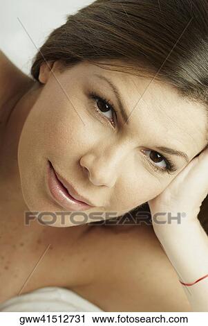 Portrait of a mid adult woman lying on her side View Large Photo Image Stock Image - Portrait of a mid adult woman lying on her side. Fotosearch