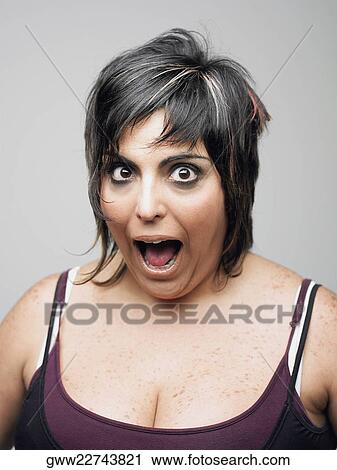 Portrait of a mid adult woman with her mouth open View Large Photo Image Stock Image - Portrait of a mid adult woman with her mouth open. Fotosearch