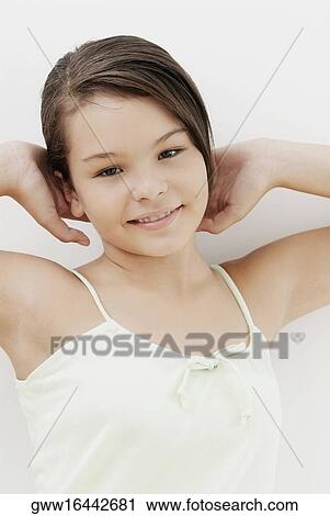 Portrait of a teenage girl stretching her arms View Large Photo Image Stock Image - Portrait of a teenage girl stretching her arms. Fotosearch