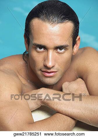 Portrait of a young man at the poolside View Large Photo Image Stock Image - Portrait of a young man at the poolside. Fotosearch