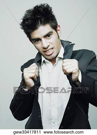 Portrait of a young man posing View Large Photo Image Stock Image - Portrait of a young man posing. Fotosearch