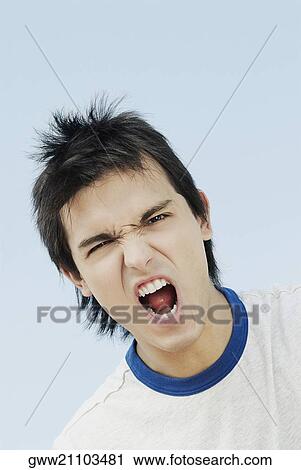 Portrait of a young man shouting View Large Photo Image Stock Image - Portrait of a young man shouting. Fotosearch