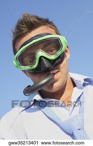 Portrait of a young man wearing a snorkel View Large Photo Image Stock Image - Portrait of a young man wearing a snorkel. Fotosearch