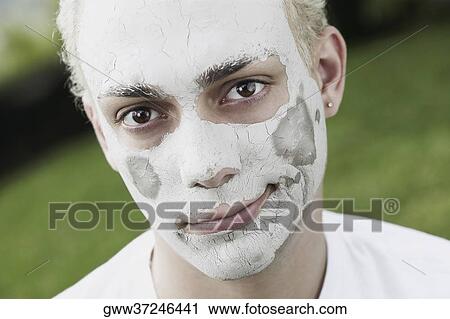 Portrait of a young man wearing a facial mask View Large Photo Image Stock Image - Portrait of a young man wearing a facial mask. Fotosearch