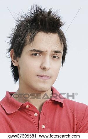 Portrait of a young man with spiky hair View Large Photo Image Stock Image - Portrait of a young man with spiky hair. Fotosearch