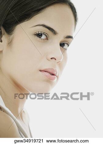 Portrait of a young woman staring View Large Photo Image Stock Image - Portrait of a young woman staring. Fotosearch