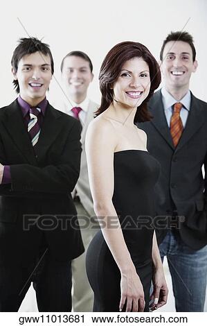 Portrait of four business executives standing together and smiling View Large Photo Image Stock Image - Portrait of four business executives standing together and smiling. Fotosearch