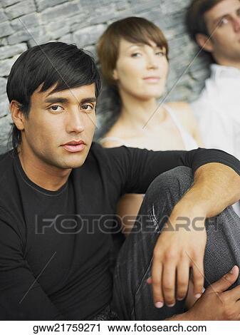 Portrait of two young men and a young woman View Large Photo Image Stock Image - Portrait of two young men and a young woman. Fotosearch