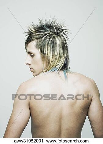 Rear view of a semi-dressed young man View Large Photo Image Stock Image - Rear view of a semi-dressed young man. Fotosearch