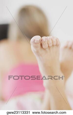 Rear view of a woman lying down View Large Photo Image Stock Image - Rear view of a woman lying down. Fotosearch