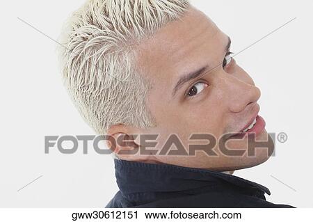 Rear view of a young man smiling View Large Photo Image Stock Image - Rear view of a young man smiling. Fotosearch