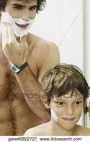 Reflection of a boy with his father applying shaving cream on their faces View Large Photo Image Stock Image - Reflection of a boy with his father applying shaving cream on their faces. Fotosearch
