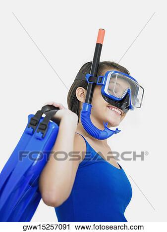 Side profile of a teenage girl smiling with a snorkel on her face and holding flippers View Large Photo Image Stock Image - Side profile of a teenage girl smiling with a snorkel on her face and holding flippers. Fotosearch