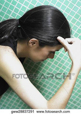 Side profile of a young woman thinking View Large Photo Image Stock Image - Side profile of a young woman thinking. Fotosearch