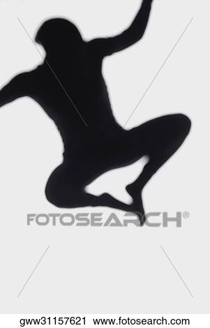 Silhouette of a person jumping View Large Photo Image Stock Image - Silhouette of a person jumping. Fotosearch