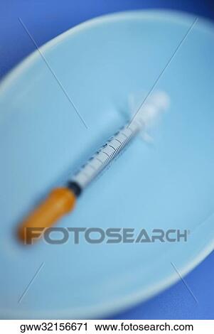 Syringe in a tray View Large Photo Image Stock Image - Syringe in a tray. Fotosearch