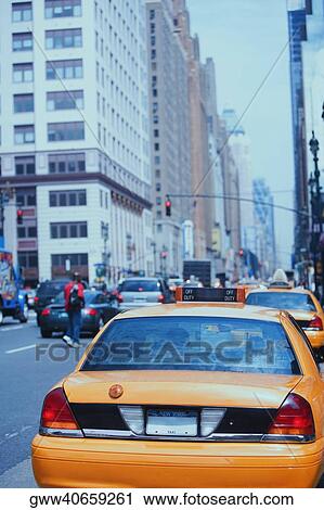 Stock Image - Taxis parked along the road, Manhattan, New York City, New York State, USA. Fotosearch