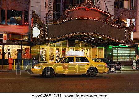Yellow taxi in front of a building, New York City, New York State, USA View Large Photo Image Stock Image - Yellow taxi in front of a building, New York City, New York State, USA. Fotosearch