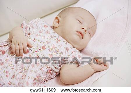 Close-up of a baby girl sleeping View Large Photo Image Stock Image - Close-up of a baby girl sleeping. Fotosearch