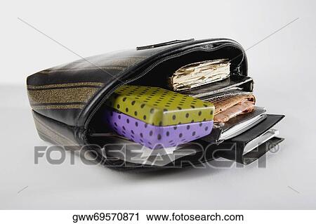 Close-up of a bag filled with documents and a diary View Large Photo Image Stock Image - Close-up of a bag filled with documents and a diary. Fotosearch