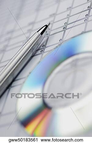 Close-up of a ballpoint pen and a CD on a document View Large Photo Image Stock Image - Close-up of a ballpoint pen and a CD on a document. Fotosearch