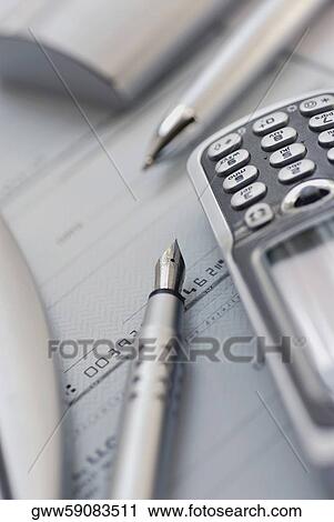 Close-up of a ballpoint pen and a fountain pen with a mobile phone View Large Photo Image Stock Image - Close-up of a ballpoint pen and a fountain pen with a mobile phone. Fotosearch