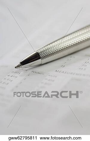 Stock Image - Close-up of a ballpoint pen on a document. Fotosearch