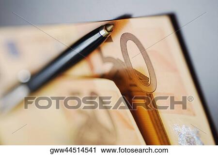 Close-up of a ballpoint pen on two Euro notes View Large Photo Image Stock Image - Close-up of a ballpoint pen on two Euro notes. Fotosearch