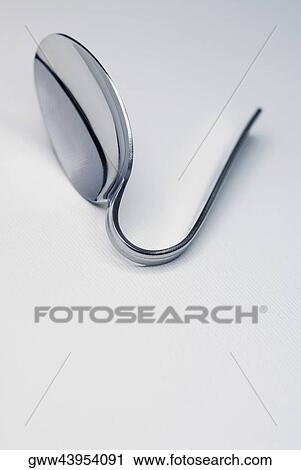Close-up of a bent spoon View Large Photo Image Stock Image - Close-up of a bent spoon. Fotosearch
