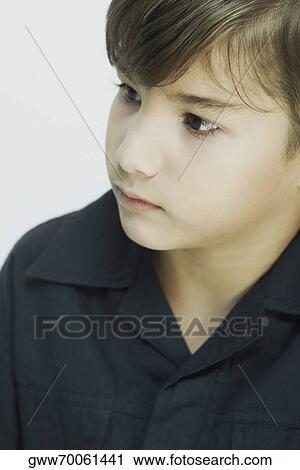 Stock Image - Close-up of a boy looking sideways. Fotosearch