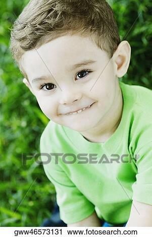 Stock Image - Close-up of a boy smiling. Fotosearch