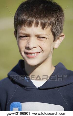 Close-up of a boy smirking View Large Photo Image Stock Image - Close-up of a boy smirking. Fotosearch