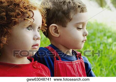 Close-up of a boy with his sister View Large Photo Image Stock Image - Close-up of a boy with his sister. Fotosearch