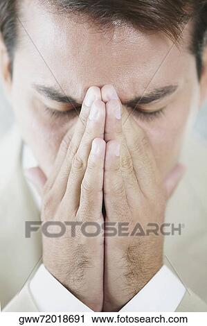 Close-up of a businessman looking sad View Large Photo Image Stock Image - Close-up of a businessman looking sad. Fotosearch
