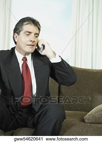 Stock Image - Close-up of a businessman talking on a mobile phone. Fotosearch