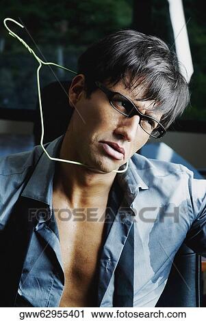 Close-up of a businessman with a hanger around his neck View Large Photo Image Stock Image - Close-up of a businessman with a hanger around his neck. Fotosearch