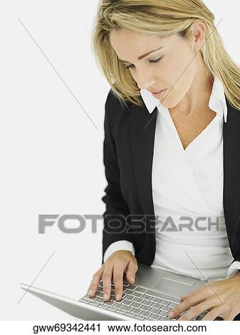 Close-up of a businesswoman using a laptop View Large Photo Image Stock Image - Close-up of a businesswoman using a laptop. Fotosearch