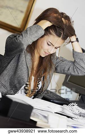 Close-up of a businesswoman with her hands in her hair View Large Photo Image Stock Image - Close-up of a businesswoman with her hands in her hair. Fotosearch